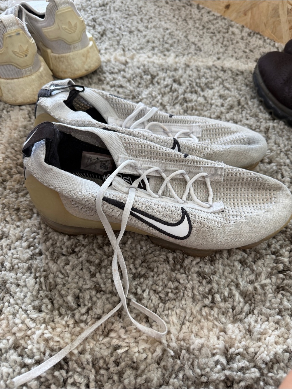 Nike Men's White Flyknit Athletic Shoes with Black Swoosh